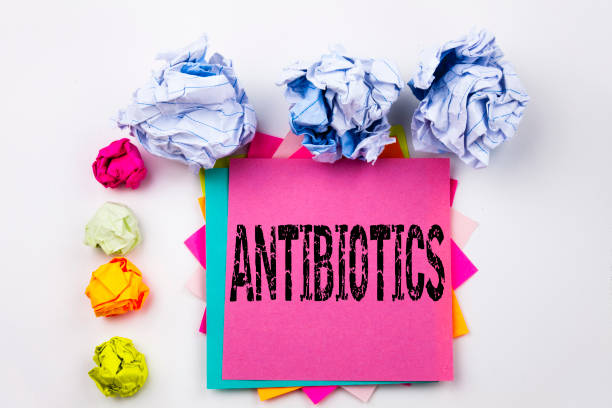 istock Writing text showing Antibiotics written on sticky note in office with screw paper balls. Business concept for Health care Prescription drug medication on the white isolated background. 883160932