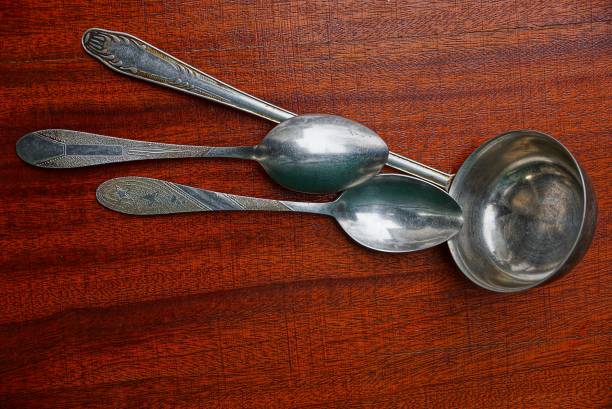 istock a large scoop and two spoons on a red table 883164192