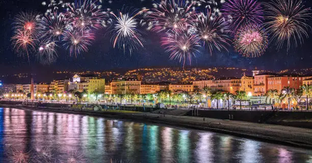 Photo of Night view of Nice with fireworks on the black sky, Cote d'Azur, French Riviera, France