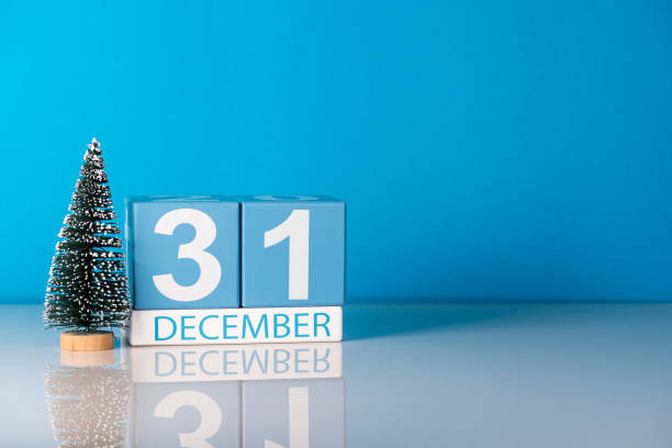 New year. December 31st. Day 31 of december month, calendar with little christmas tree on blue background. Winter time. Empty space for text. New year concept New year. December 31st. Day 31 of december month, calendar with little christmas tree on blue background. Winter time. Empty space for text. New year concept. december 31 stock pictures, royalty-free photos & images