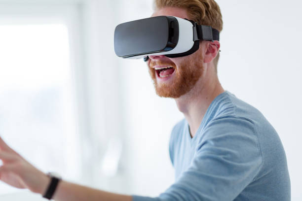 istock Young handsome man trying virtual reality glasses 883166786