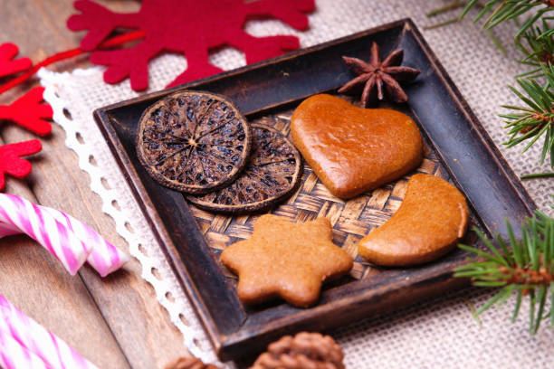 istock Gingerbread cookies, fir tree, spices and candy canes 883167300
