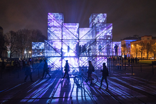 Riga, Latvia - November 20, 2017: Different violetly lit cubic installations in the Esplanade of Riga amidst the light festival “Staro Riga”.