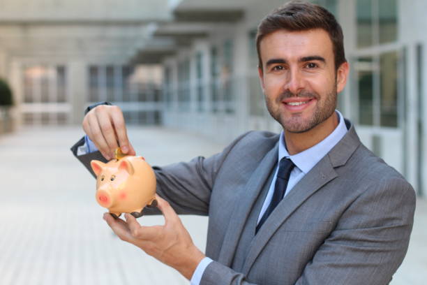 istock Stacking money together at home 883167666