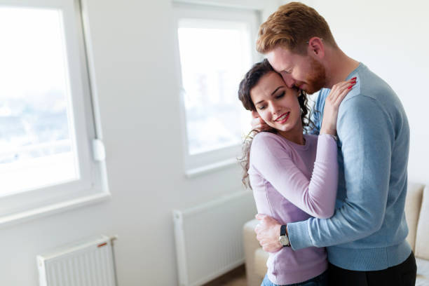 istock Happy couple having romantic moments at home 883170024