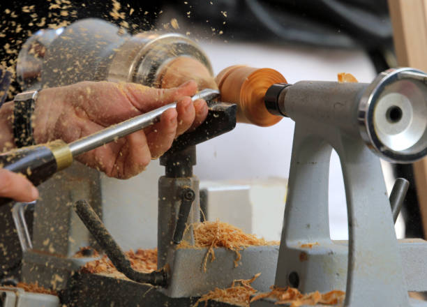 istock hand of an artisan when working with the lathe 883174486