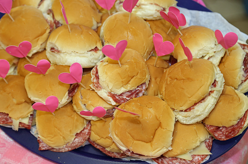 many sandwiches with a heart-shaped flag at  birthday party