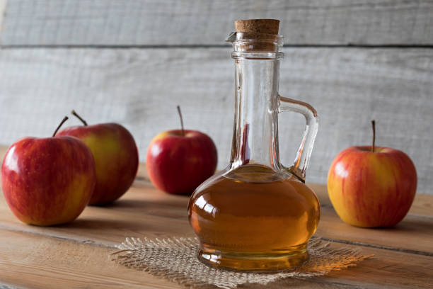 istock A bottle of apple cider vinegar with apples 883181748