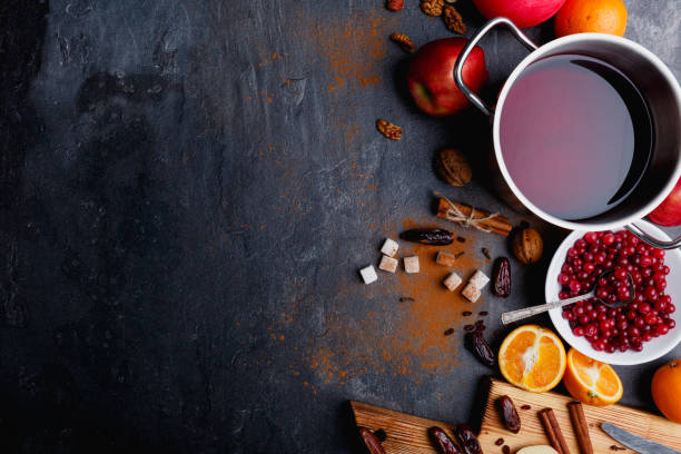 istock A pan with mulled wine, cranberries, orange, apples and sprinkled cinnamon. View from above. 883184354