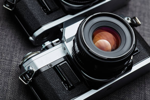 istock Old vintage film cameras on canvas 883189964