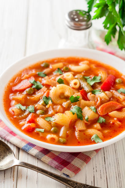 istock Italian minestrone soup on white wooden background. 883196842