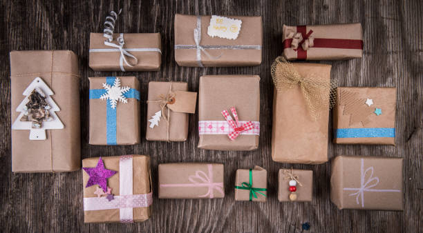 istock Christmas decorated presents on rustic wood, collection, top view 883197848