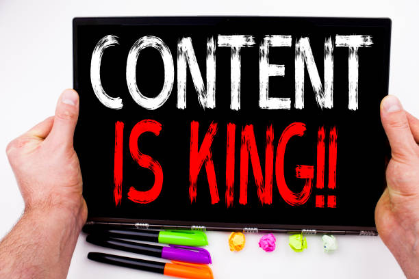 istock Content Is King text written on tablet, computer in the office with marker, pen, stationery. Business concept for Business Marketing Online Media white background with copy space 883204068