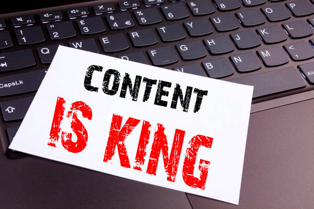 istock Writing Content Is King text made in the office close-up on laptop computer keyboard. Business concept for Business Marketing Online Media Workshop on the black background with copy space 883205584
