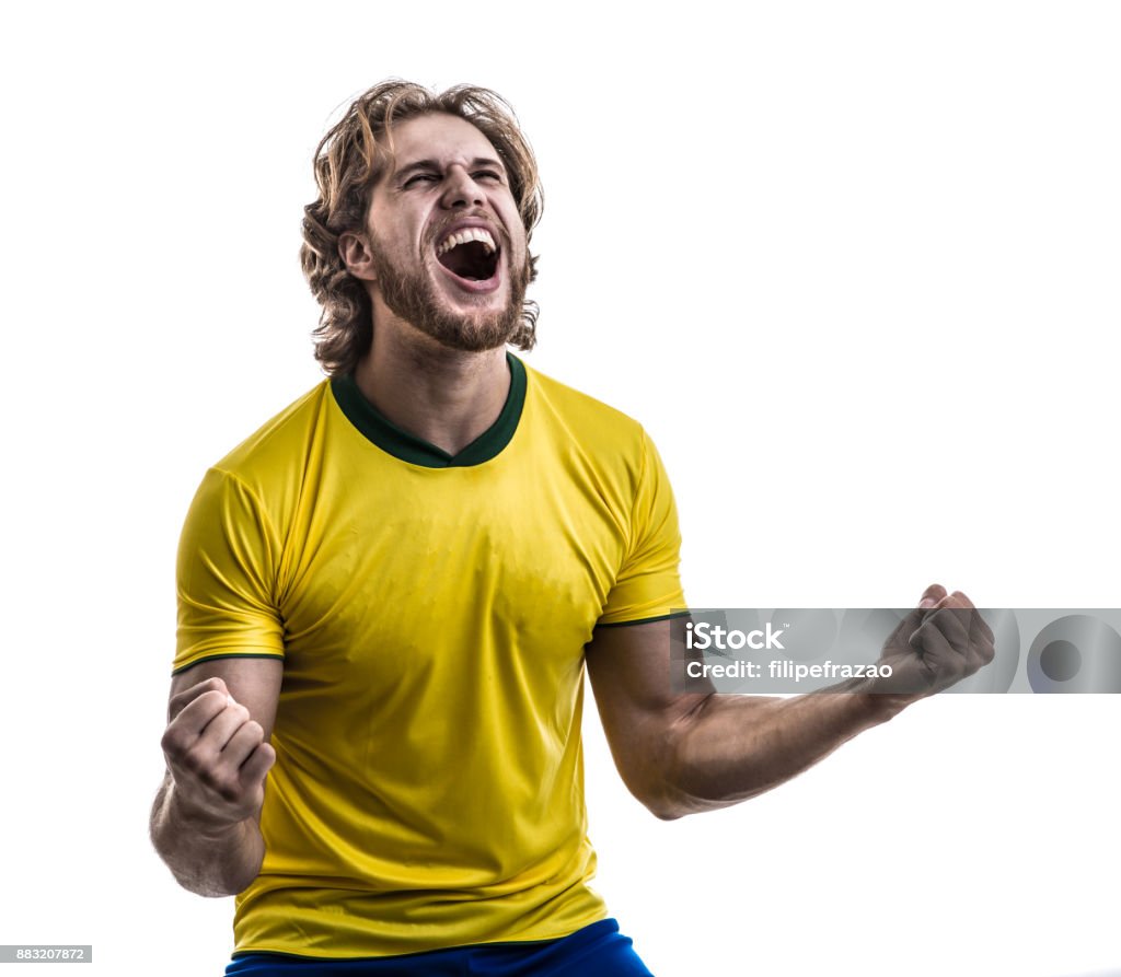 Male athlete / fan in yellow uniform celebrating on white background People collection Fan - Enthusiast Stock Photo