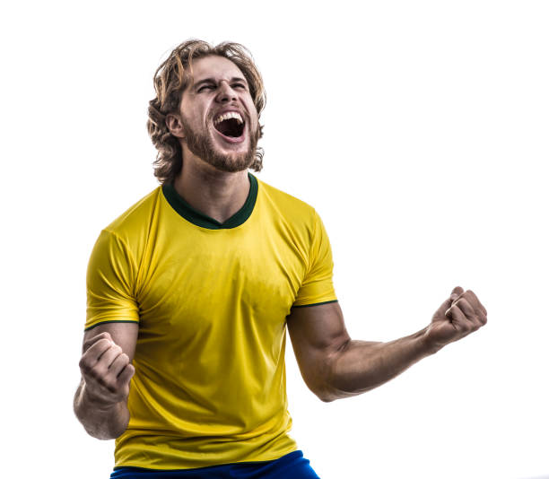 male athlete / fan in yellow uniform celebrating on white background - fan sport football male imagens e fotografias de stock