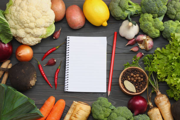 istock Fresh vegetables on dark wooden background. Mockup for menu or recipe. Top view with copy space 883207906