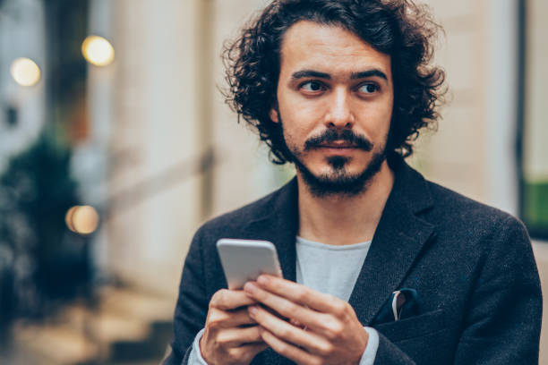 istock Man texting in the city 883212582