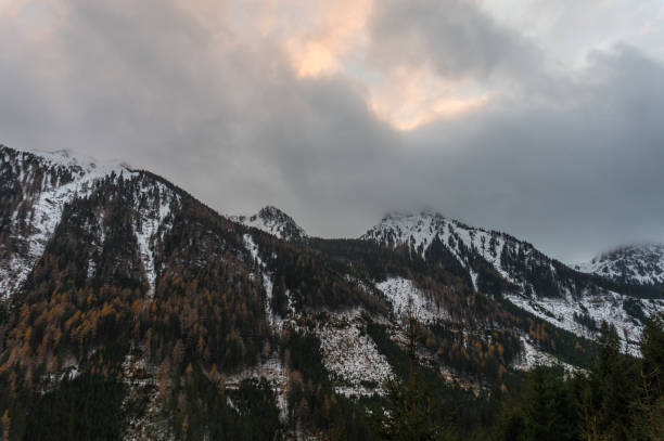 istock Sunset on a very cloudy day in the Austrian Alps 883212802