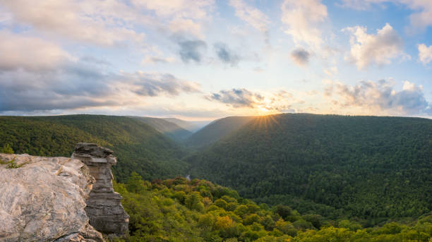 istock Sun shining over a valley at Lindy Point in West Virginia 883218514