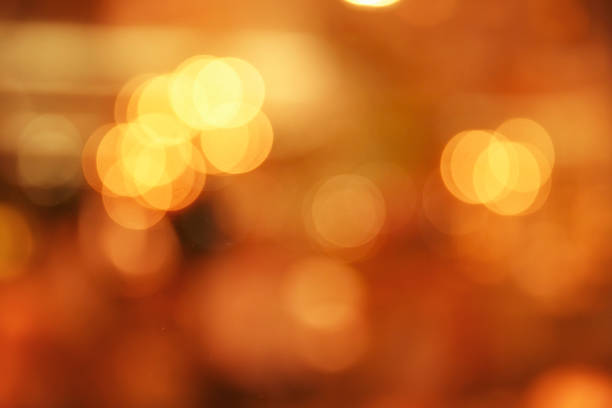 istock Christmas blurred background in red and gold with beautiful bokeh and lights 883219210