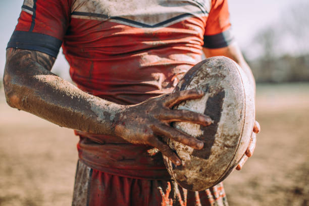 istock Rugby player standing on a playing field with ball 883219290