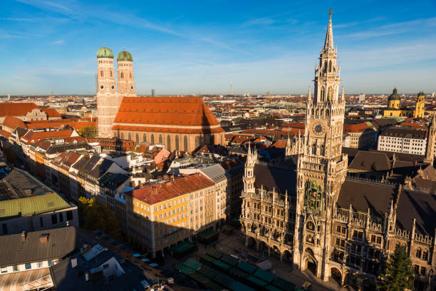 Marienplatz with the New Town Hall and the Cathedral in Munich, Germany Marienplatz in Munich, Germany munich city hall stock pictures, royalty-free photos & images