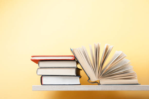 istock Open book, hardback books on wooden table. Education background. Back to school. Copy space for text. 883231284