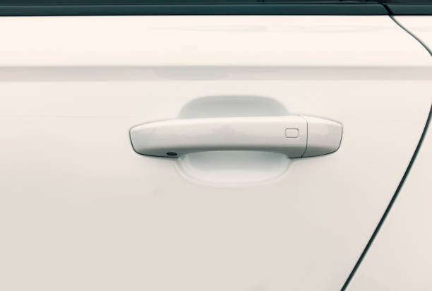 istock door handles on white car 883261518