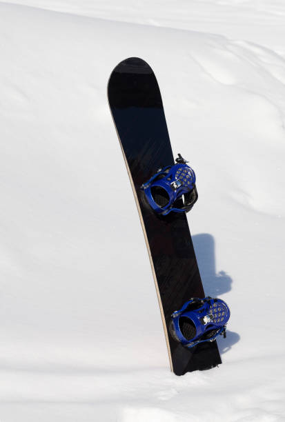 istock Snowboard in snowdrift after snowfall 883261662