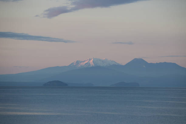 View at Mt Ruapehu over Lake Taupo in a cold and windy Summer morning.\n