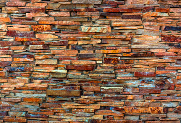 istock Fragment of artistic wall made with multiple stones 883264836