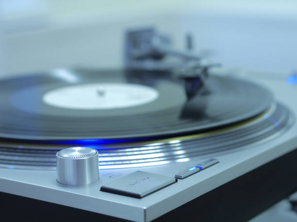 istock Classic stereo turntable player with musical vinyl record. 883270616