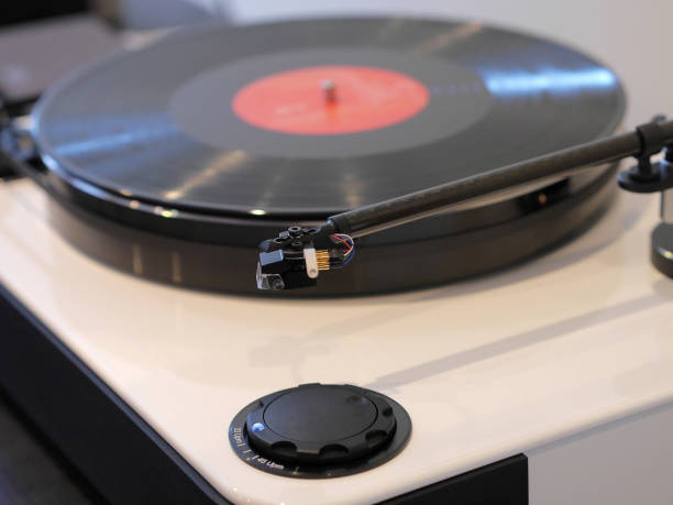 istock Classic stereo turntable player with musical vinyl record. 883270754