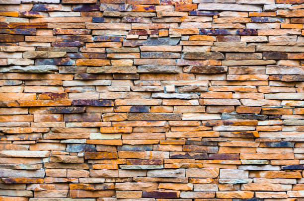 istock Fragment of artistic wall made with multiple stones 883274522