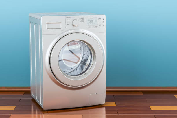 istock Modern washing machine in room on the wooden floor, 3D rendering 883283308