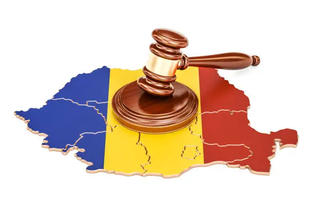 Photo of Wooden Gavel on map of Romania, 3D rendering isolated on white background