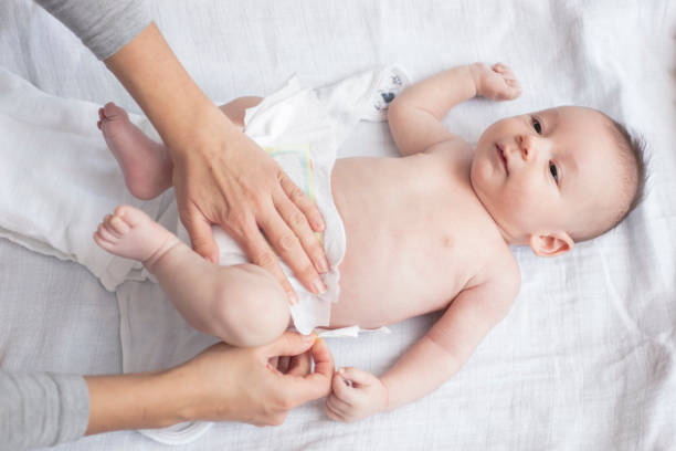 istock Mother happily playing with her baby 883284764