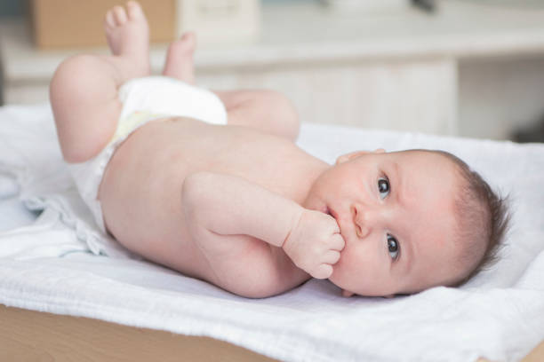 istock Mother happily playing with her baby 883285236