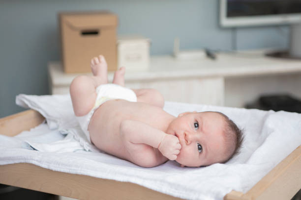 istock Mother happily playing with her baby 883285238