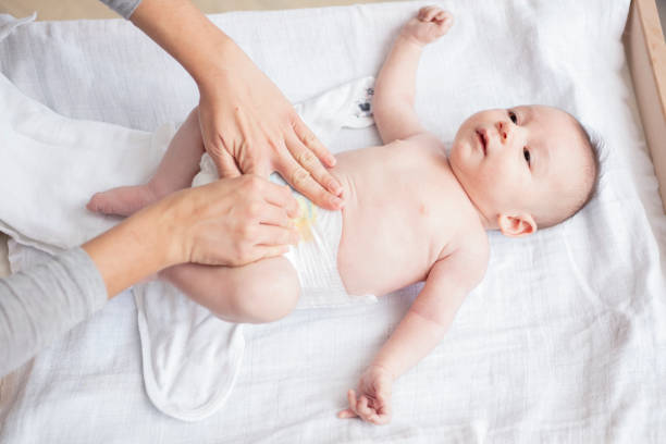 istock Mother happily playing with her baby 883287430