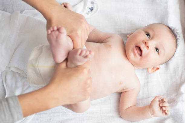 istock Mother happily playing with her baby 883297780