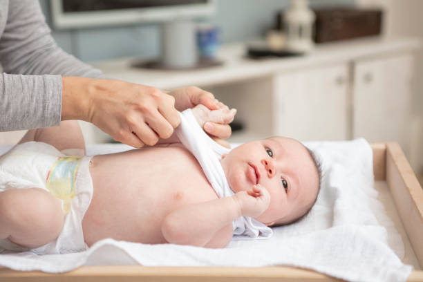 istock Mother happily playing with her baby 883308042