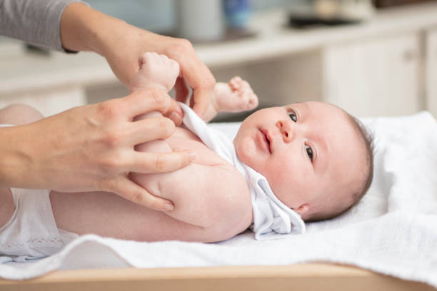 istock Mother happily playing with her baby 883308060