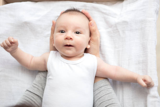 istock Mother happily playing with her baby 883313646
