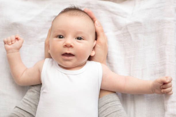 istock Mother happily playing with her baby 883313932