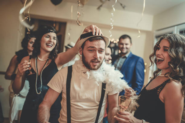 istock Group of Smiling Friends Having Great Party at Night 883332032
