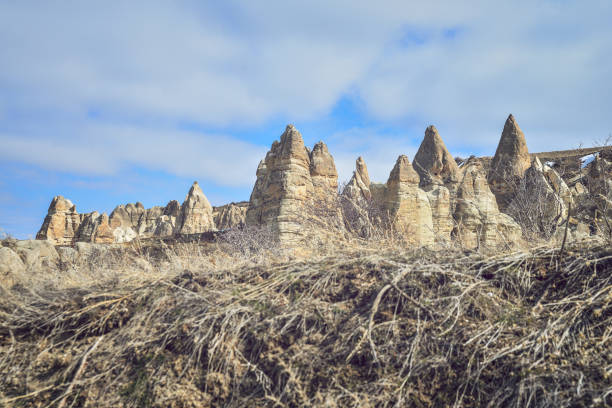 Pasabag in Cappadocia, Turkey,  is located on the road to Zelve, coming from Göreme or Avanos. This site  is called Monks Valley or Valley of the Monks.   The Pasabag valley contains some of the most striking fairy chimneys in Cappadocia with twin and even triple rock caps. Goreme, Cappadocia, Turkey. Göreme Historical National Park and the Rock Sites of Cappadocia.