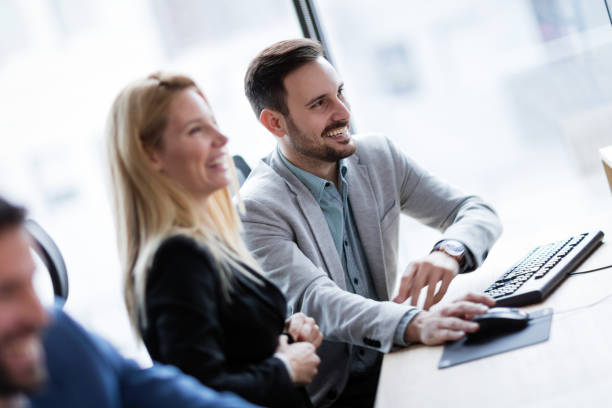 istock Picture of businesspeople working on computer together 883351620