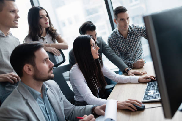 istock Picture of businesspeople working on computer together 883353140